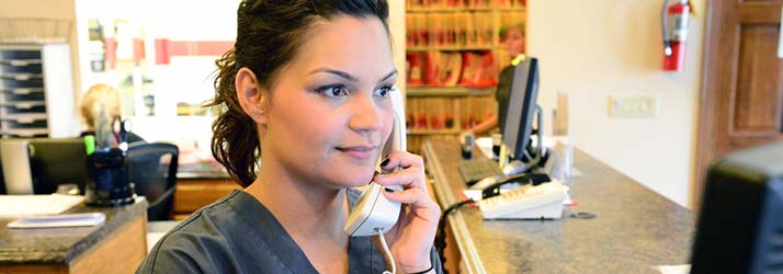 Chiropractic South Sioux City NE Staff Member On Phone