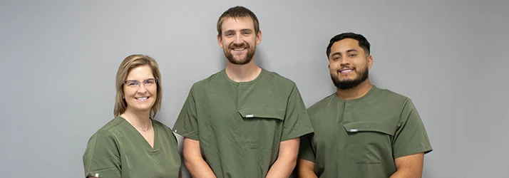 Robin Dr. Seth-DPT and Freddie Pose for a Physical Therapist Team Photo